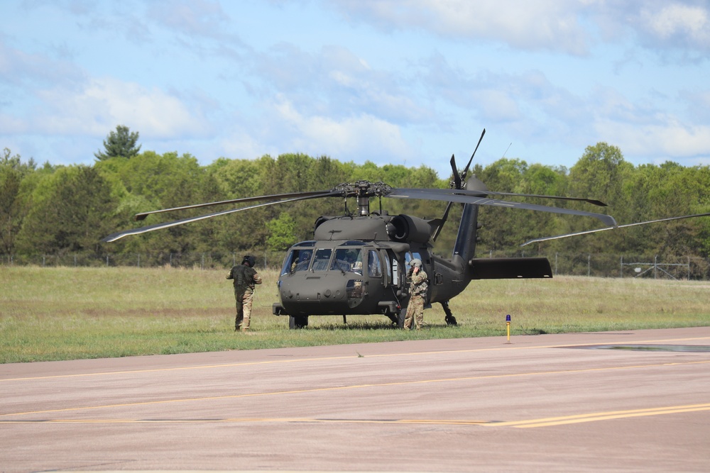 Soldiers with 13th Battalion, 100th Regiment hold slingload training at McCoy, Wisconsin National Guard Black Hawks, crews assist