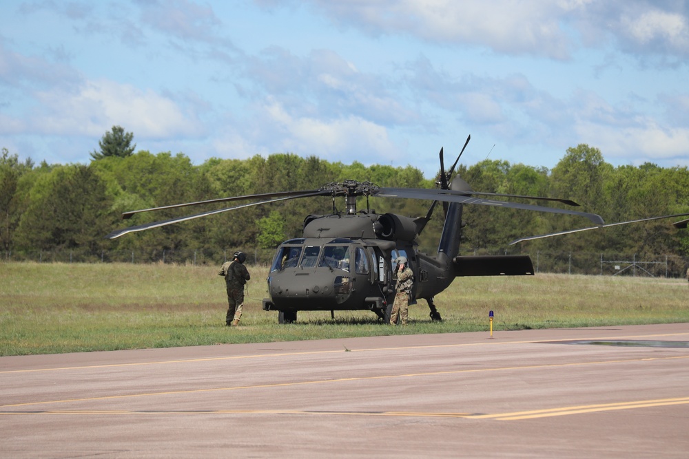 Soldiers with 13th Battalion, 100th Regiment hold slingload training at McCoy, Wisconsin National Guard Black Hawks, crews assist
