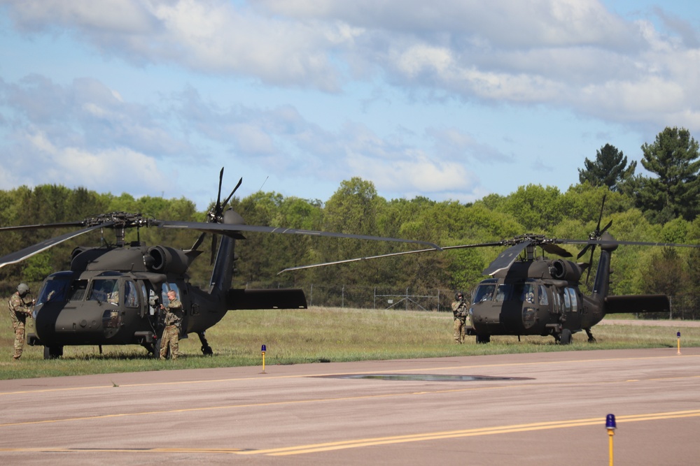 Soldiers with 13th Battalion, 100th Regiment hold slingload training at McCoy, Wisconsin National Guard Black Hawks, crews assist