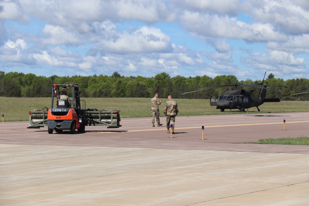 Soldiers with 13th Battalion, 100th Regiment hold slingload training at McCoy, Wisconsin National Guard Black Hawks, crews assist
