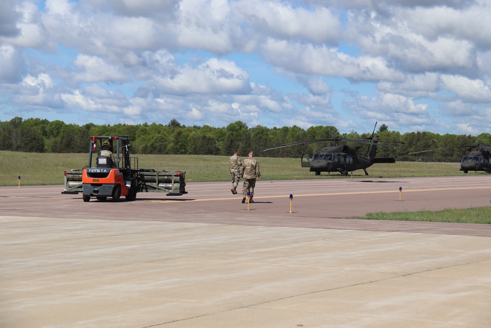 Soldiers with 13th Battalion, 100th Regiment hold slingload training at McCoy, Wisconsin National Guard Black Hawks, crews assist