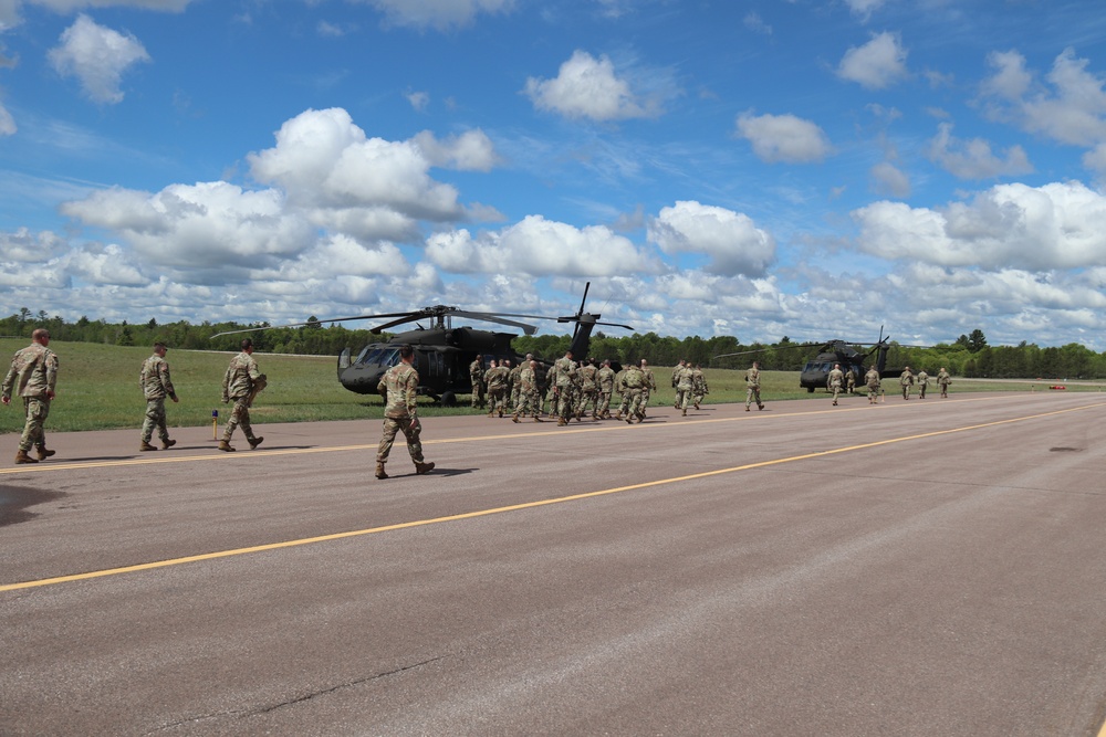 Soldiers with 13th Battalion, 100th Regiment hold slingload training at McCoy, Wisconsin National Guard Black Hawks, crews assist