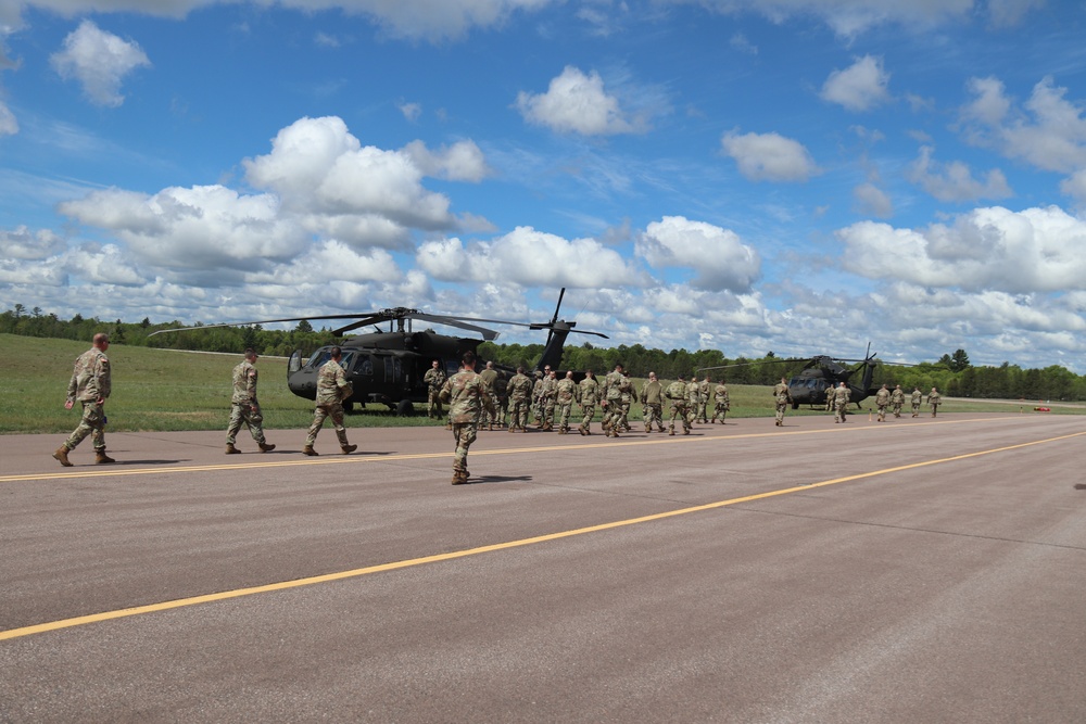 Soldiers with 13th Battalion, 100th Regiment hold slingload training at McCoy, Wisconsin National Guard Black Hawks, crews assist