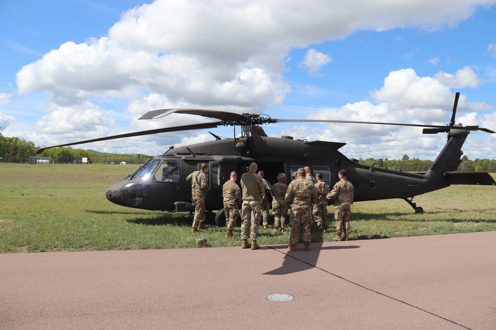 Soldiers with 13th Battalion, 100th Regiment hold slingload training at McCoy, Wisconsin National Guard Black Hawks, crews assist