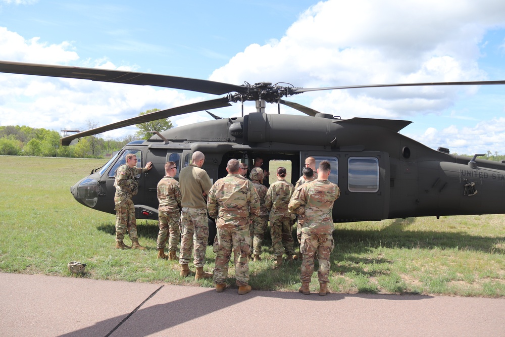 Soldiers with 13th Battalion, 100th Regiment hold slingload training at McCoy, Wisconsin National Guard Black Hawks, crews assist