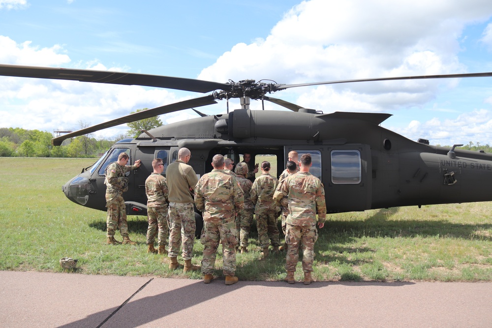 Soldiers with 13th Battalion, 100th Regiment hold slingload training at McCoy, Wisconsin National Guard Black Hawks, crews assist