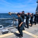 U.S. Navy #wolfpack Sailors transport the aft flag staff to the flight deck