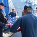 U.S. Navy #wolfpack Sailors fold and stow the ensign