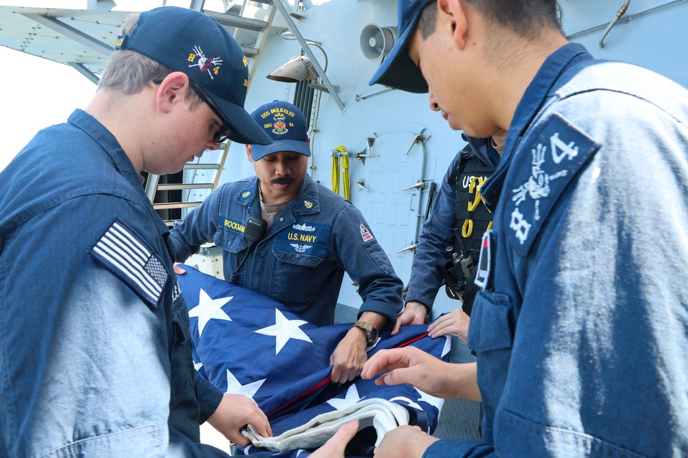 Chief Personnel Specialist William Brockman and #wolfpack shipmates fold and stows the ensign