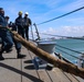 #wolfpack Seaman Samuel Ofori pulls in a mooring line from an approaching tug boat