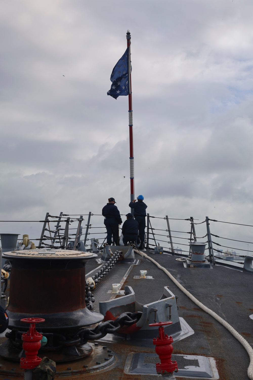 U.S. Navy #wolfpack Sailors lower the jack staff and flag from the fo’c’sle