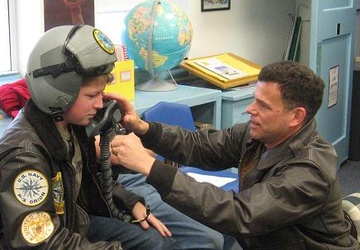 Igniting Dreams: Commander Malloy Inspires Young Michael Hayward at Dahlgren School in 2009