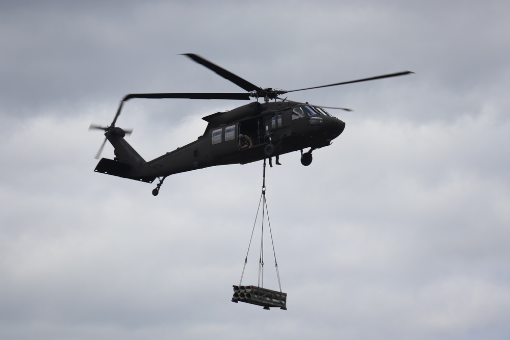 Soldiers with 13th Battalion, 100th Regiment hold slingload training at McCoy, Wisconsin National Guard Black Hawks, crews assist