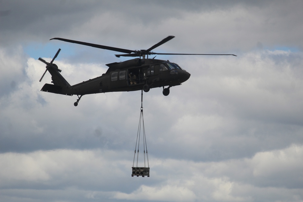 Soldiers with 13th Battalion, 100th Regiment hold slingload training at McCoy, Wisconsin National Guard Black Hawks, crews assist