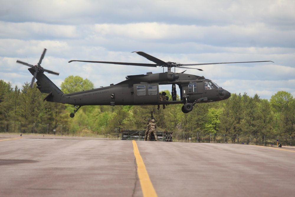 Soldiers with 13th Battalion, 100th Regiment hold slingload training at McCoy, Wisconsin National Guard Black Hawks, crews assist