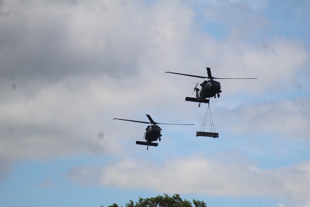 Soldiers with 13th Battalion, 100th Regiment hold slingload training at McCoy, Wisconsin National Guard Black Hawks, crews assist