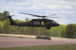 Soldiers with 13th Battalion, 100th Regiment hold slingload training at McCoy, Wisconsin National Guard Black Hawks, crews assist