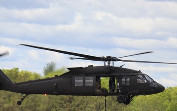 Soldiers with 13th Battalion, 100th Regiment hold slingload training at McCoy, Wisconsin National Guard Black Hawks, crews assist