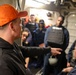 IT1 William O’Neill provides training feedback after a simulated active shooter and hostage scenario
