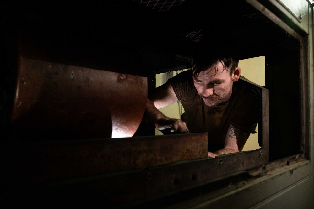 Sailor Conducts Routine Maintenance