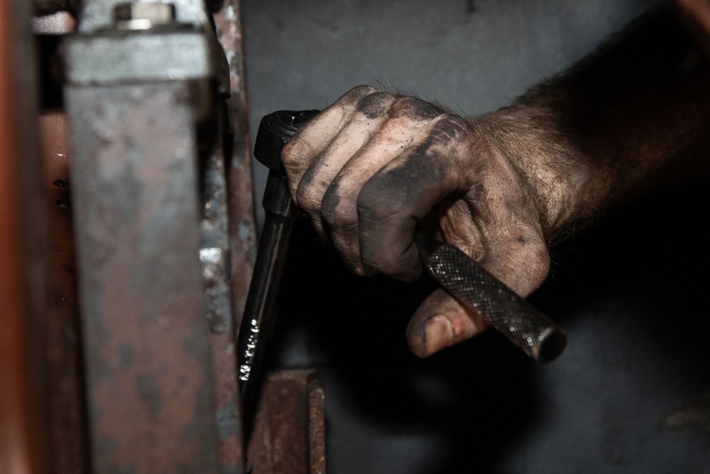Sailor Conducts Routine Maintenance
