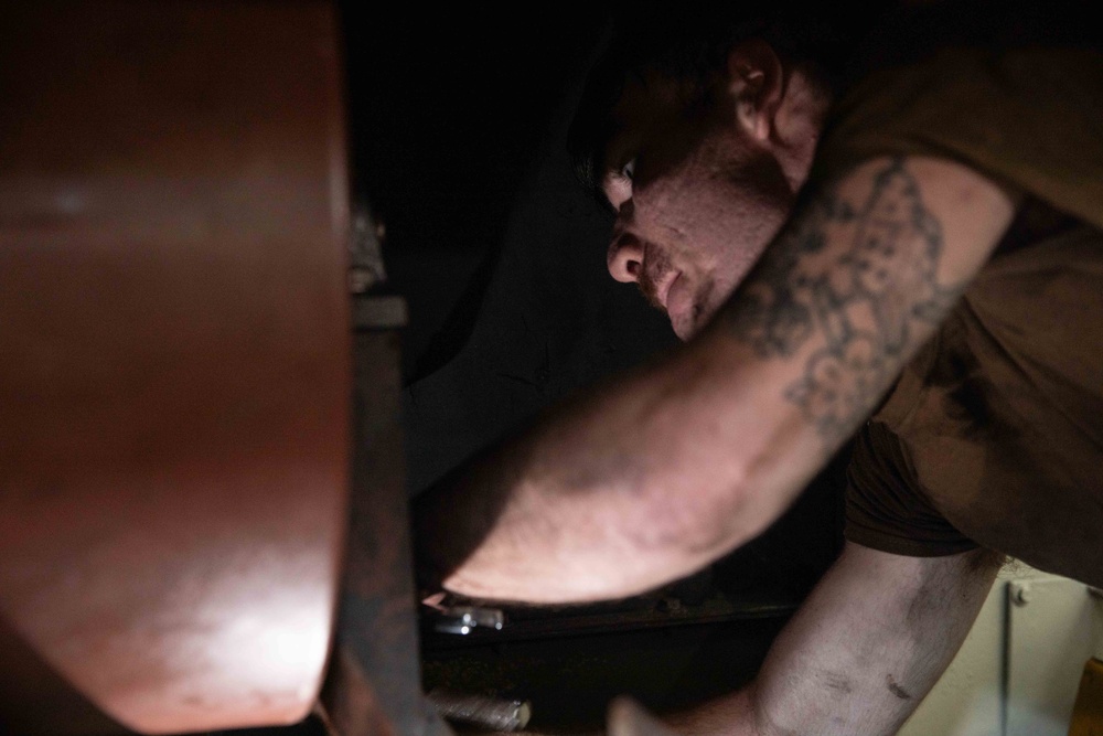 Sailor Conducts Routine Maintenance