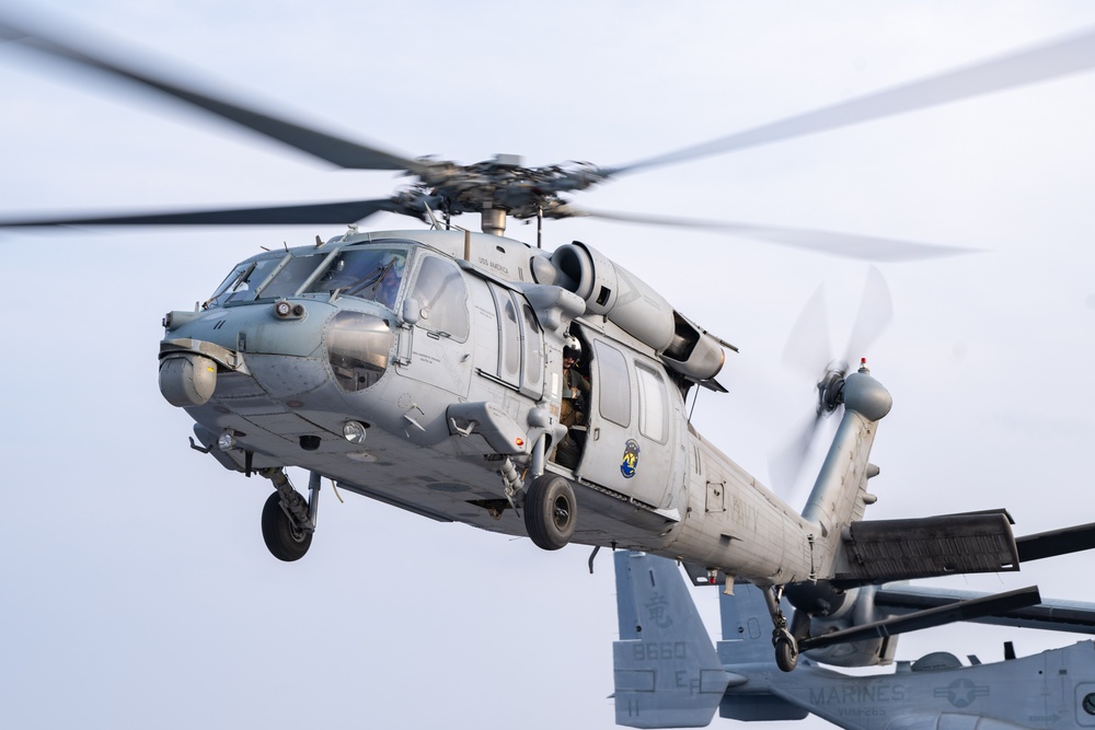 USS America (LHA 6) conducts flight operations