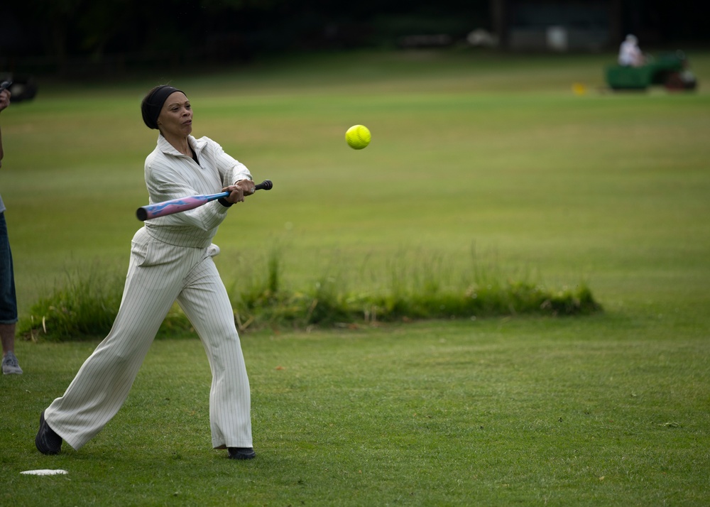 U.S. service members play cricket and softball with local nationals