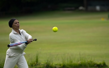 U.S. service members play cricket and softball with local nationals
