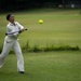 U.S. service members play cricket and softball with local nationals