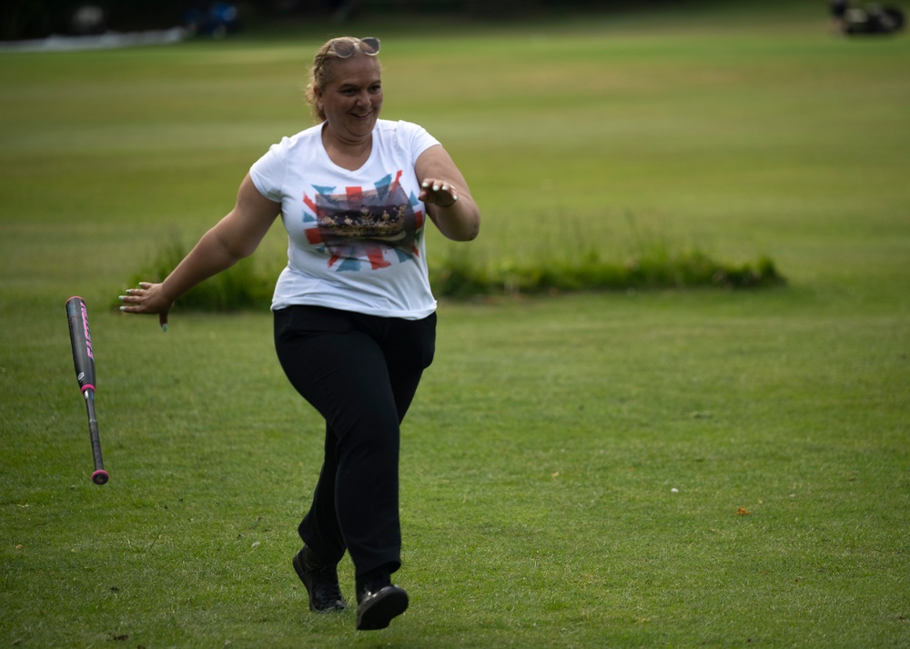 U.S. service members play cricket and softball with local nationals