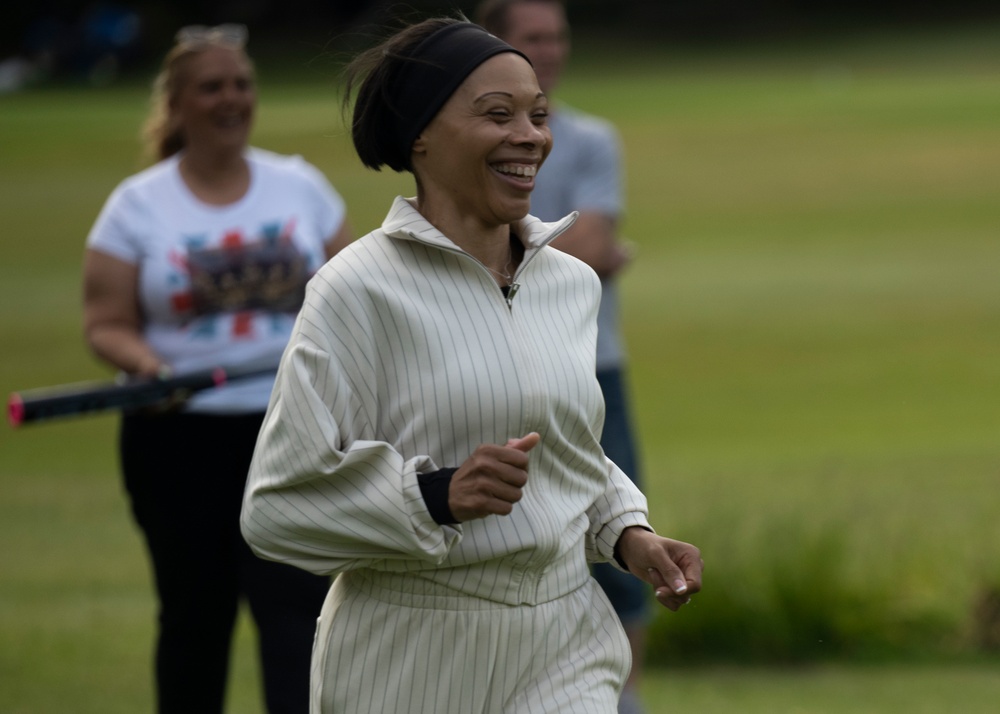 U.S. service members play cricket and softball with local nationals