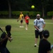 U.S. service members play cricket and softball with local nationals