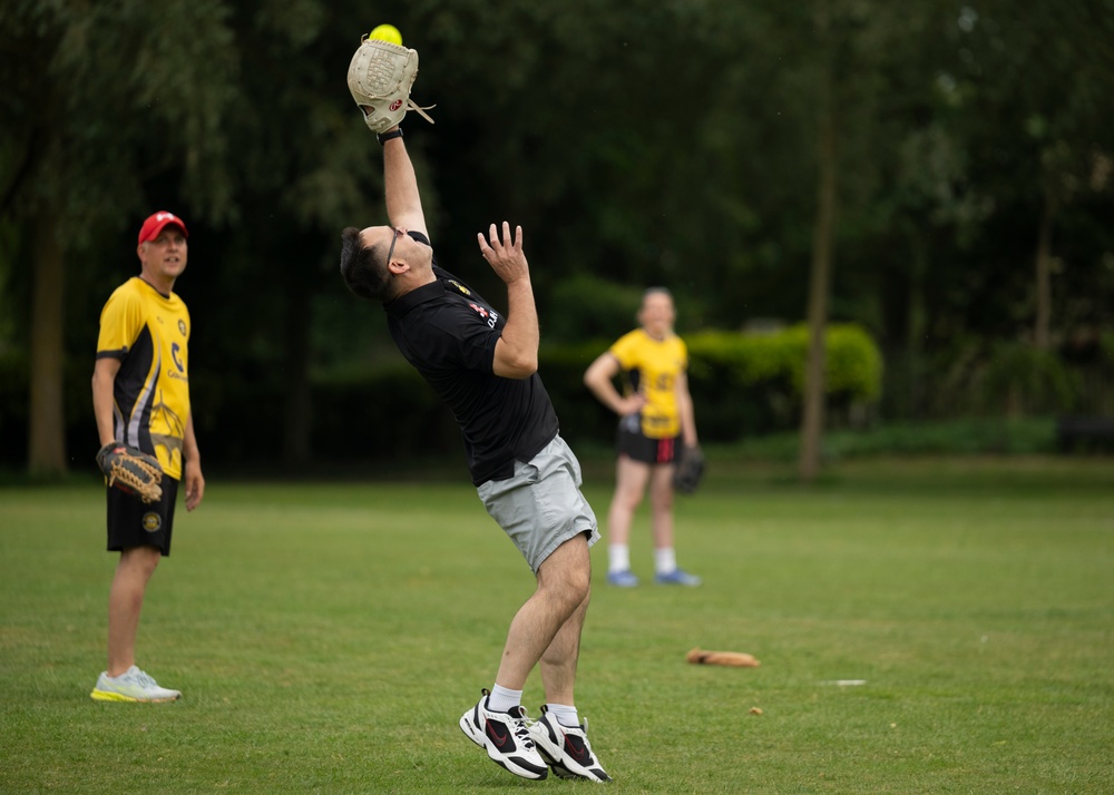 U.S. service members play cricket and softball with local nationals