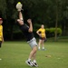 U.S. service members play cricket and softball with local nationals