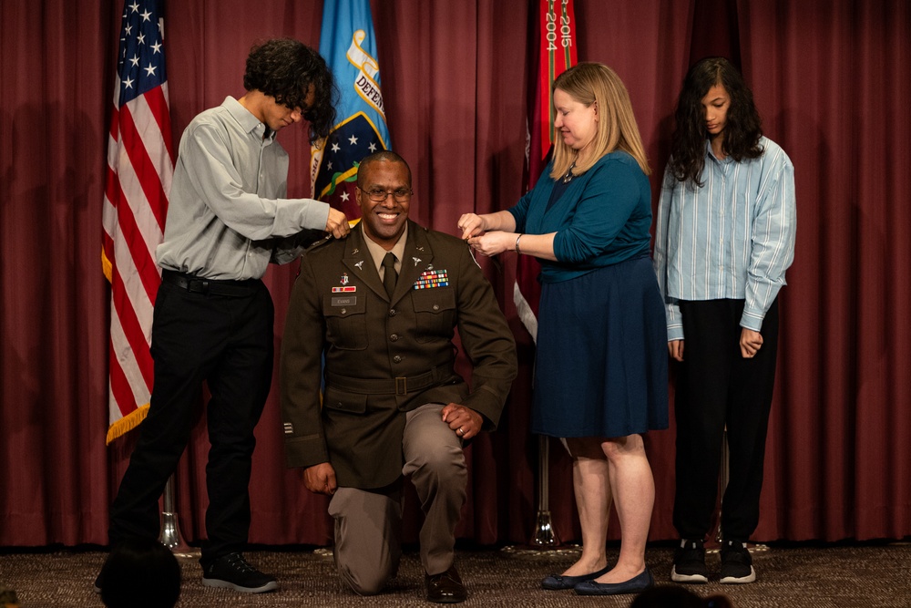 1Brig. Gen. Clinton K. Murray (left) Commanding General, United States Army Medical Center of Excellence (MEDCoE) and Chief of the U.S Army Medical Corps presided over the Promotion ceremony of BHSL Director Col. Oseola Evans with his family