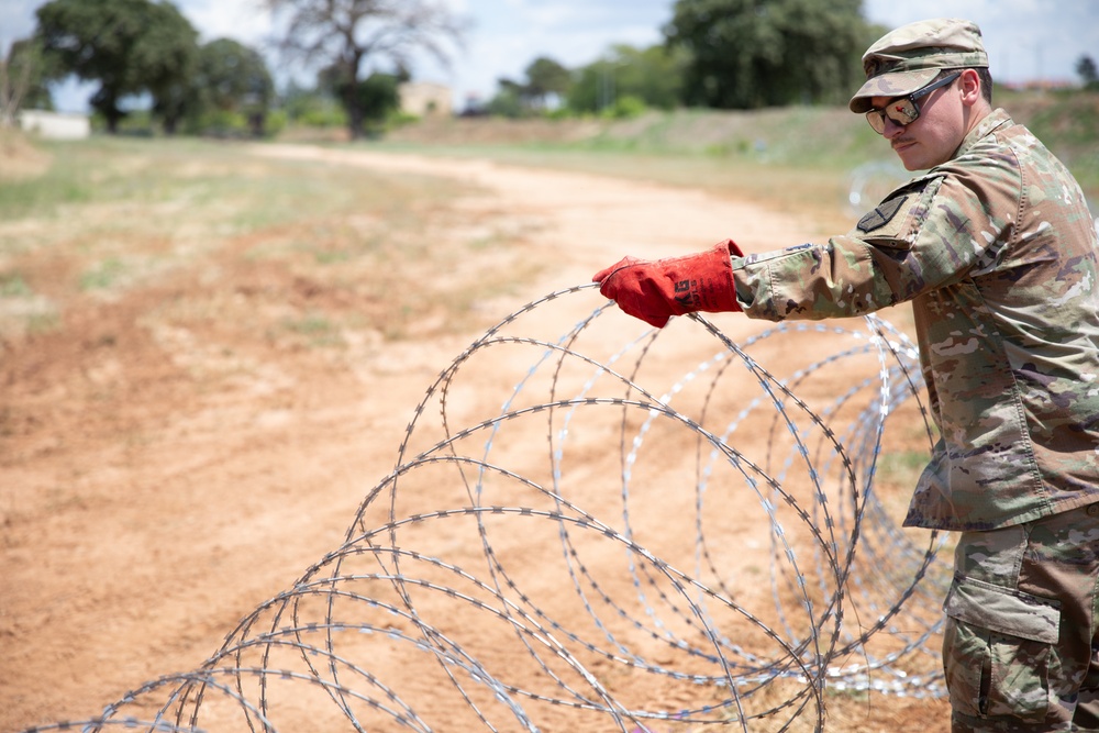U.S. Soldier sets up wire during DEFENDER 25