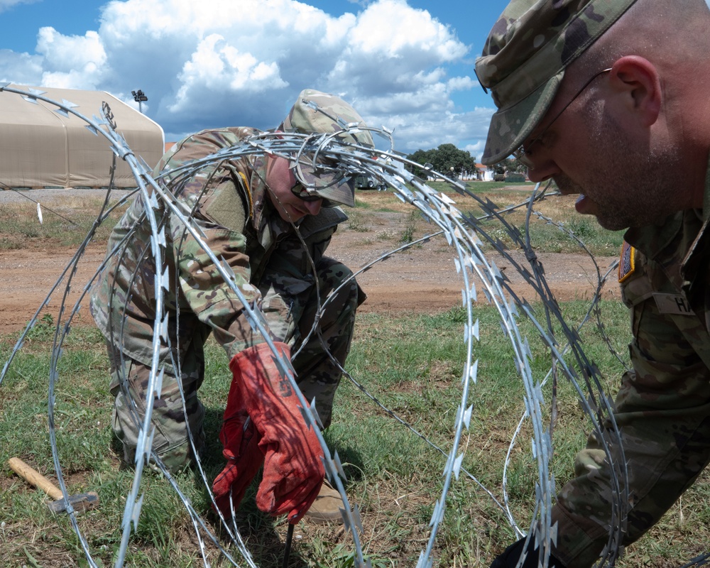 151st CBRN Battalion emplaces concertina wire during Immediate Response 25