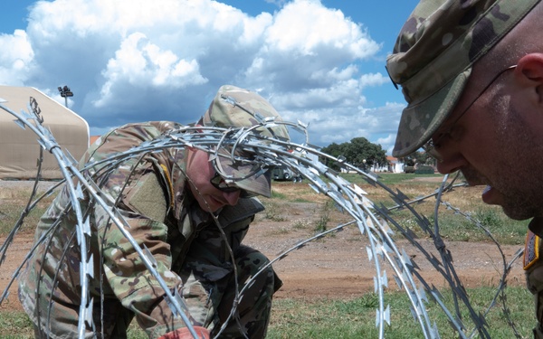 151st CBRN Battalion emplaces concertina wire during Immediate Response 25