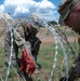 151st CBRN Battalion emplaces concertina wire during Immediate Response 25