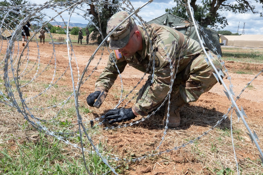 151st CBRN Battalion emplaces concertina wire during Immediate Response 25