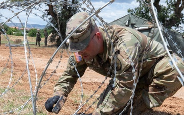 151st CBRN Battalion emplaces concertina wire during Immediate Response 25