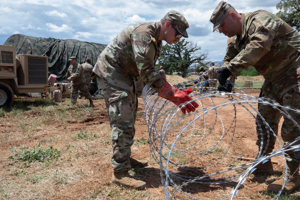 151st CBRN Battalion emplaces concertina wire during Immediate Response 25