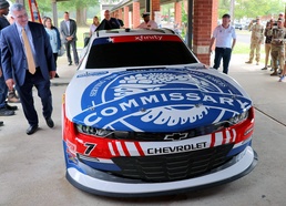 New DeCA-themed race car logo unveiled at Fort Gregg-Adams Commissary ahead of simulator’s 54-store tour