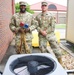 HVAC technicians perform check of AC unit