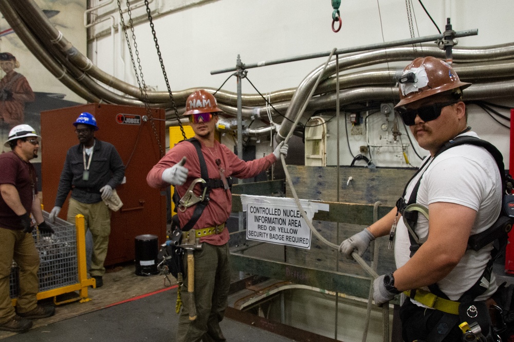 Contractors and Puget Sound Naval Shipyard workers conduct routine operations and ship maintenance aboard USS Ronald Reagan (CVN 76)