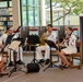 The US Pacific Fleet Band Woodwind Quintet performs at the Salt Lake- Moanalua branch of the Hawaii State Library System