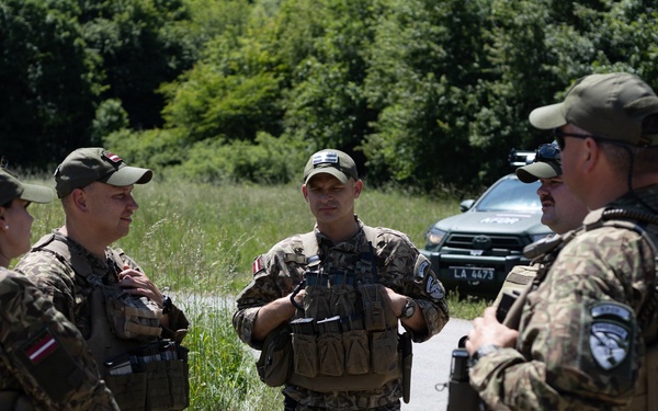 KFOR's Latvian soldiers conduct patrol along the ABL