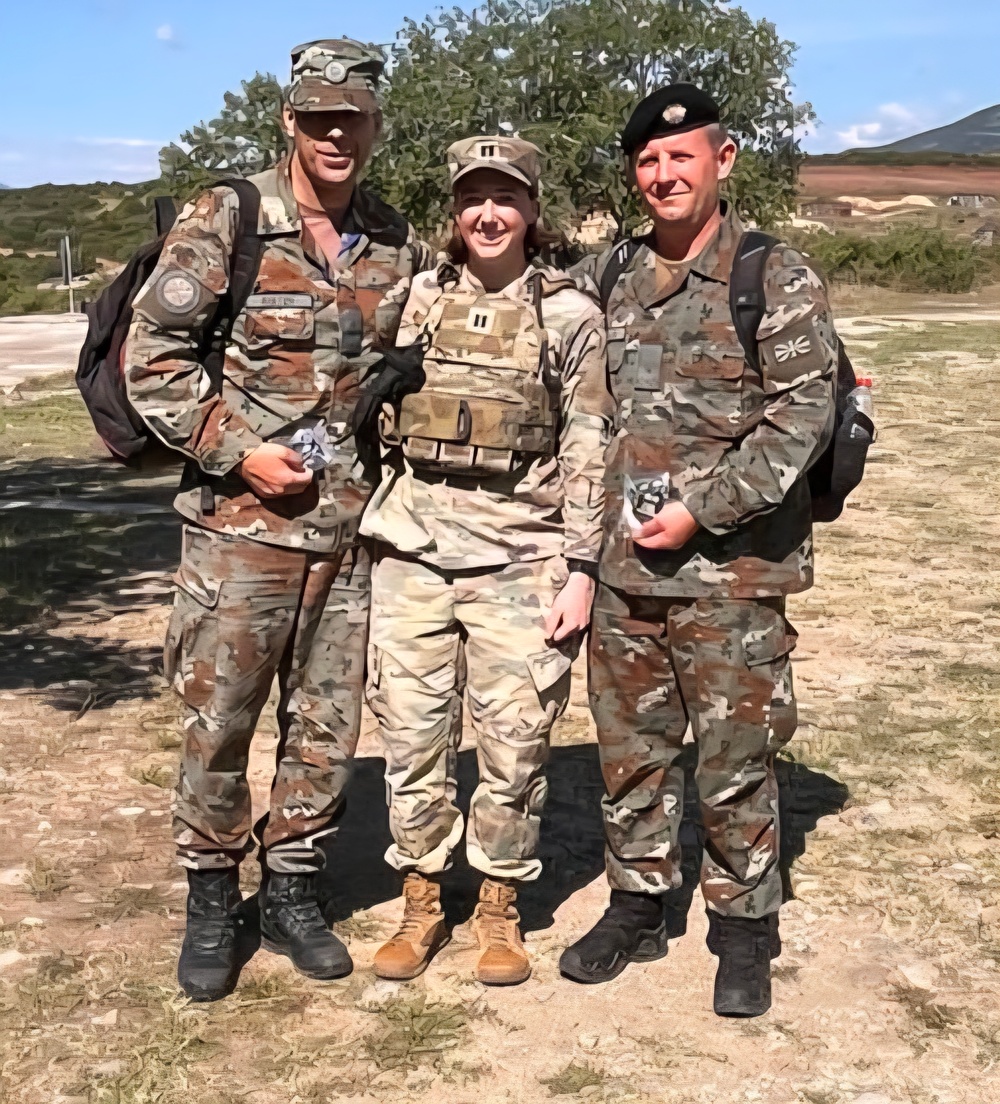 Capt. Caileigh Carei Presents North Macedonia Soldiers With 28ID Coins