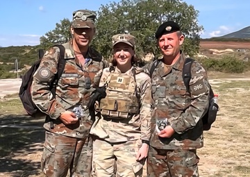 Capt. Caileigh Carei Presents North Macedonia Soldiers With 28ID Coins